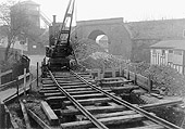 View of the steam powered mobile crane mounted on temporary track undertaking engineering work at Mill Lane