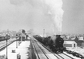 Ex-LMS 0-6-0 4F No 44590 is seen passing snow covered Northfield on a down Class J mineral train in February 1955