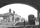 Looking towards Birmingham beneath the bridge carrying the Midland Road over the railway in April 1957
