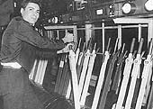 Shaun Jasper, Relief Signalman, is seen working inside Abbey Junction signal box during one of the last shifts prior to its closure in February 1992