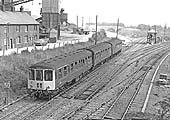 A Diesel Multiple Unit, forming the 10:15 Birmingham to Norwich service approaches Nuneaton Abbey Junction to enter the Ashby line in the early 1960s