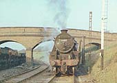Ex-LMS 5MT 4-6-0 No 45057 heads off the Ashby line at Midland Junction with Stoney Road bridge in the background