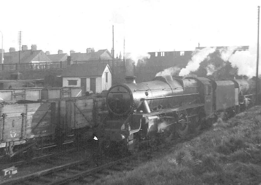 An unidentified ex-LMS 5MT 4-6-0 locomotive pilots an ex-LNER B1 4-6-0 locomotive on a New Street service from probably Cleethorpes