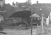 Workmen clear the debris of the bridge carrying the Midland Road over the railway on 18th November 1968