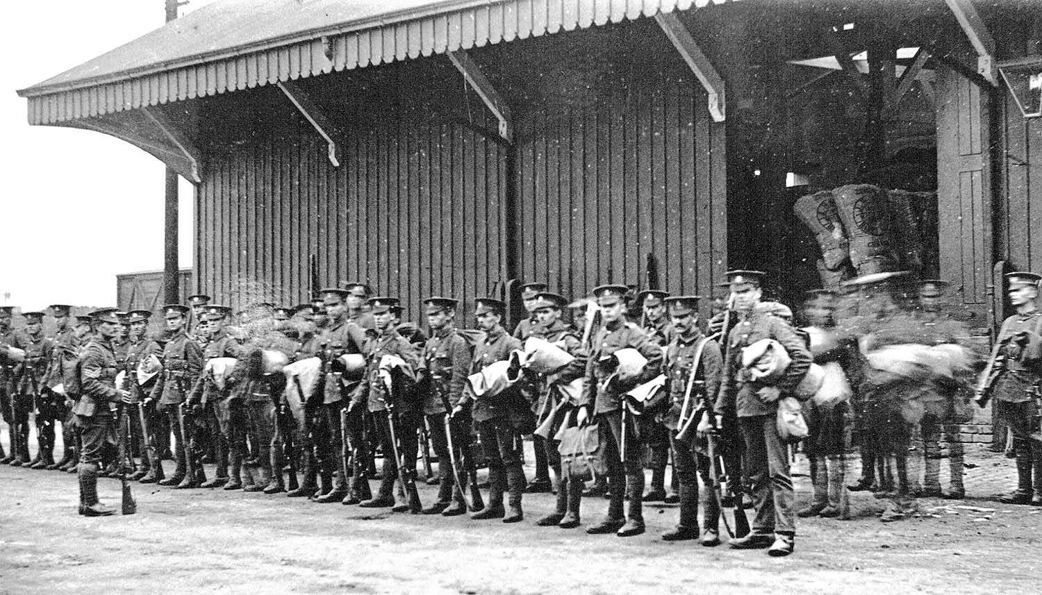One of Abbey Street station's two goods sheds is seen in the background behind soldiers of the 1st Dorset Regiment