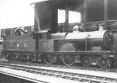 Ex-MR 3P 4-4-0 No 711, a member of the MR's 2606 class, is seen standing alongside Saltley shed's original coaling stage with the fireman taking on water