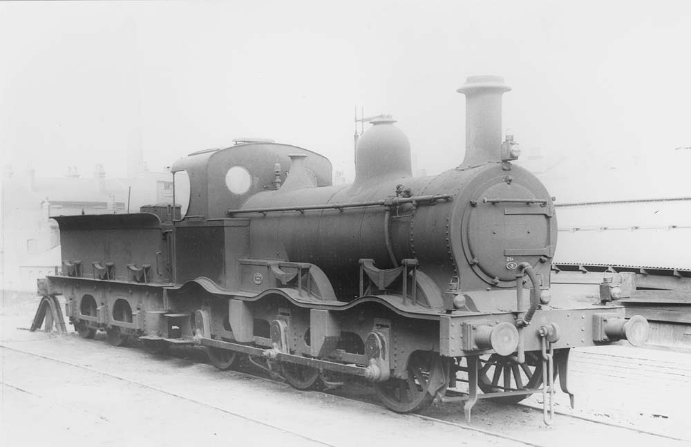 Ex-MR 2F 0-6-0 No 22818, a Kirtley outside curved framed locomotive, is seen buffered up to the stops on one of Saltley shed's stabling roads