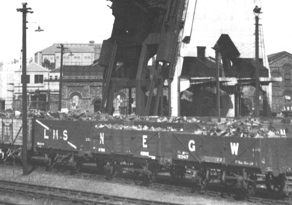 Close up view of the bottom of Saltley shed's coaling plant with the discharge chutes in black metal above the white control cabin