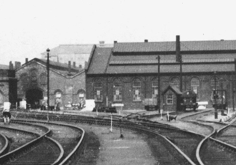 Close up showing the entrance road to No 2 shed on the left and the weighbridge hut and tank wagon containing diesel oil for the depot on the right