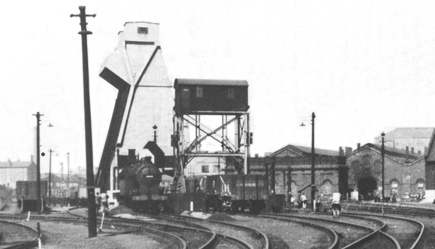 Close up Saltley shed's newly erected mechanical coaling tower and ash disposal plant with several open wagons standing awaiting to be filled
