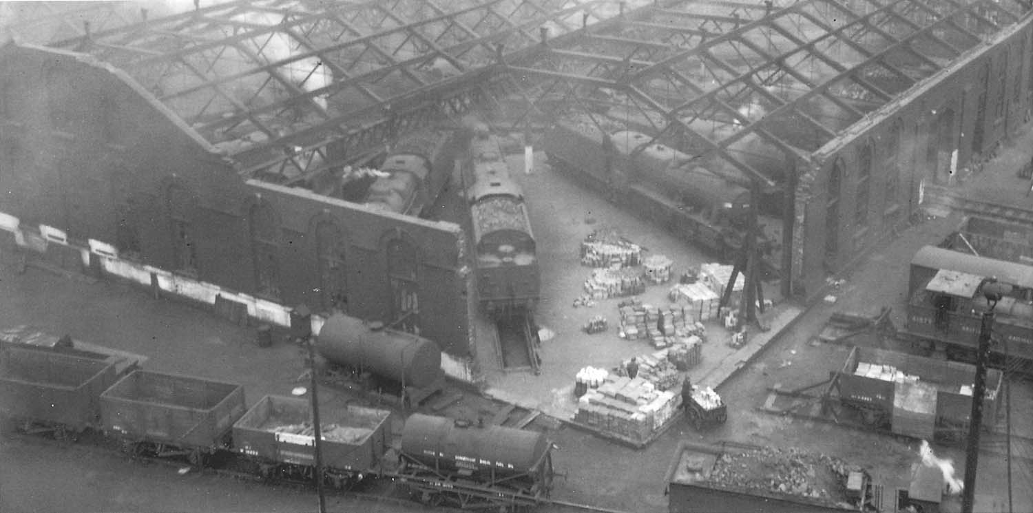 An early 1950s view of the war damaged corner to Saltley Shed's No 3 roundhouse showing a variety of ex-LMS goods locomotives around the turntable