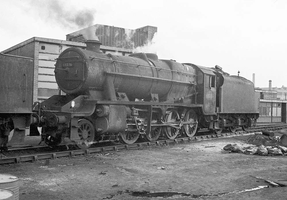 Ex-LMS 8F 2-8-0 No 48336 stands in line ready to depart Saltley shed's yard for its next turn of work