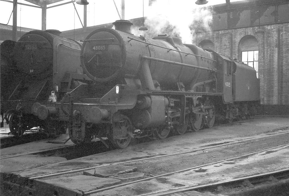 Ex-LMS 8F 2-8-0 No 48085 raises steam alongside BR Standard Class 9F 2-10-0 No 92136 inside No 3 roundhouse
