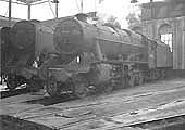 Ex-LMS 8F 2-8-0 No 48085 raises steam inside No 3 roundhouse alongside BR Class 9F 2-10-0 No 92136
