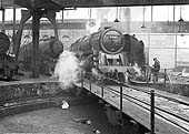 BR Standard Class 9F 2-10-0 No 92087 eases on to the turntable inside Saltley shed's No 3 roundhouse