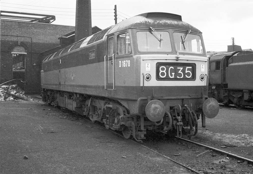 British Railways Type 4 D1678 with dual green livery and yellow end panels stands outside Saltley's No 3 roundhouse