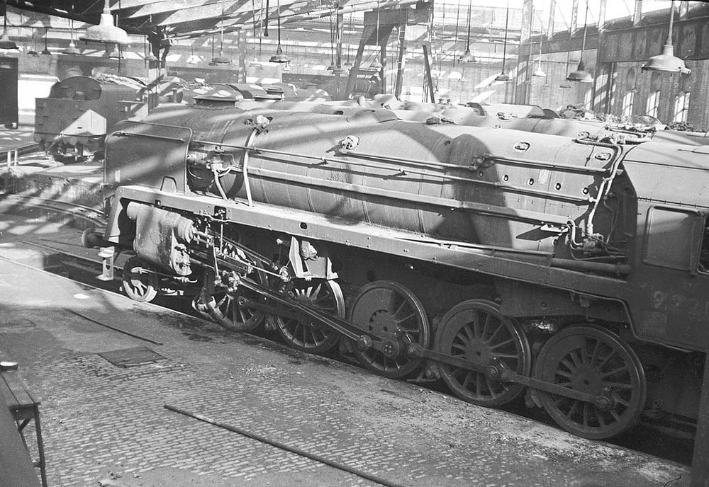 An unidentified British Railways Standard Class 9F 2-10-0 stands over an inspection pit inside Saltley No 3 roundhouse