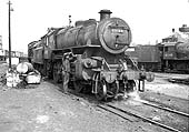British Railways built Ivatt 4MT 2-6-0 No 43108 receives a final oiling by its fireman before it sets off to work