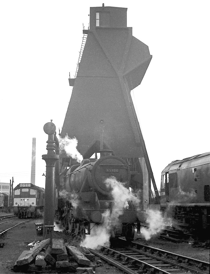 Ex-LMS 5MT 4-6-0 No 45308 moves forward from beneath Saltley shed's coaling plant after being coaled