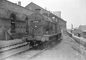 Ex-LMS 4F 0-6-0 No 44226 is seen standing on the scrap line at the rear of Saltley shed adjacent to the canal