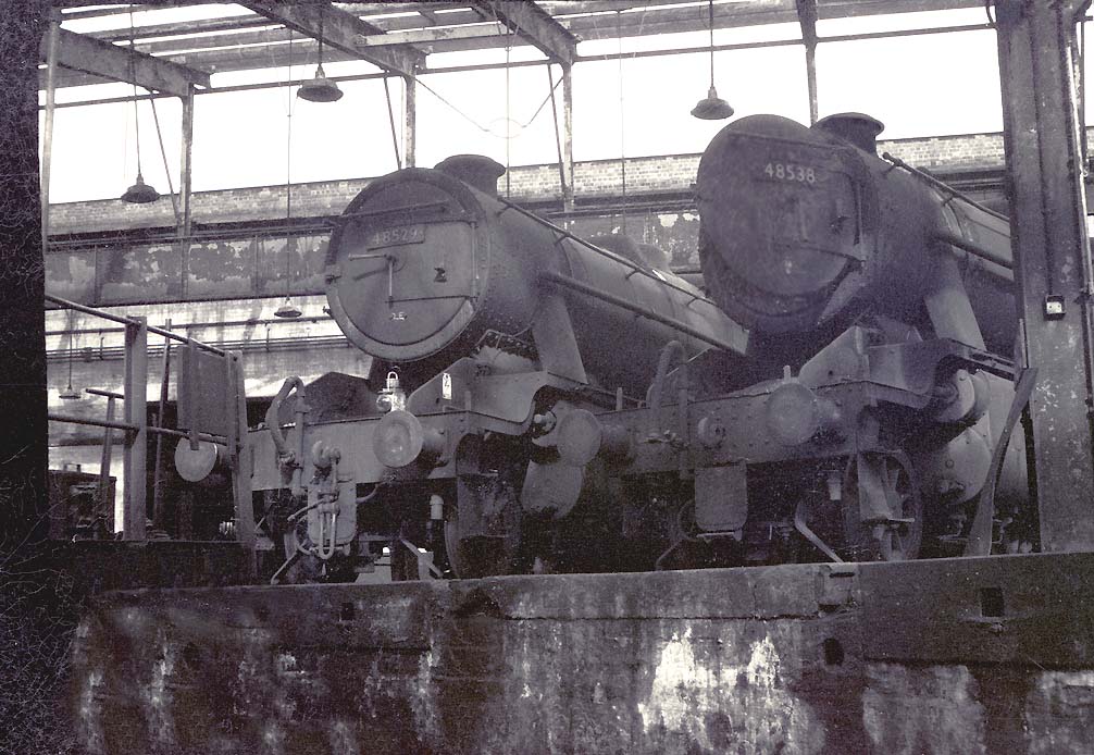 Ex-LMS 8F 2-8-0 No 48529 and classmate No 48538 stand around the turntable inside Saltley's No 3 roundhouse