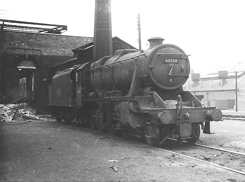 Ex-LMS 8F 2-8-0 No 48538 stands outside Saltley shed on 3rd March 1967 having been withdrawn the same month