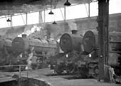 Ex-LMS 8F 2-8-0 No 48755 stands around the turntable with other Stanier 2-8-0s and 4-6-0s locomotives in 1966