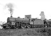 Ex-LMS 5F6P 'Crab' 2-6-0 No 42823 raises steam as it stands ready to leave Saltley shed on 26th March 1956