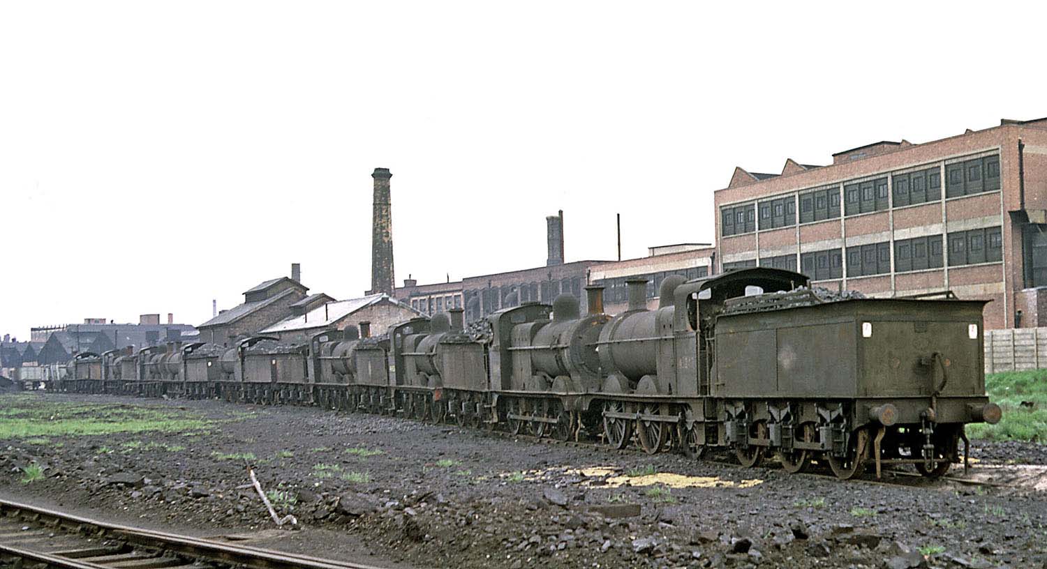Ex MR 0-6-0 No 43242 together with eight sister locomotives, standing on what had been the Saltley coal roads