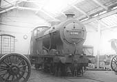 LMS 4F 0-6-0 No 4198 is seen on Friday 9th September 1932 standing in the fitting shop minus its tender but still carrying its lamp from its last trip