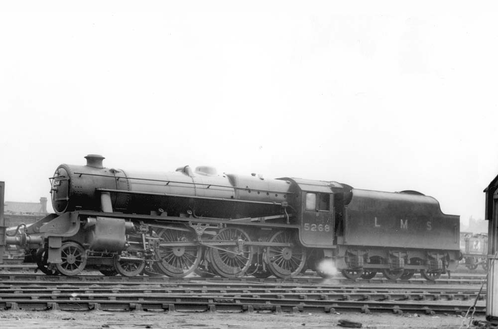 LMS 5MT 4-6-0 No 5268, one of Stanier's ubiquitous Black 5s, is seen raising steam whilst standing in line with other engines at Saltley shed