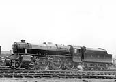 LMS 5MT 4-6-0 No 5268, one of Stanier's ubiquitous Black 5s, is seen raising steam whilst standing in line with other engines at Saltley shed