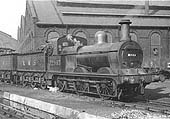 Ex-MR 2F 0-6-0 No 22983 is seen standing at the corner of Saltley shed's No 3 roundhouse with steam drifting from its safety valves
