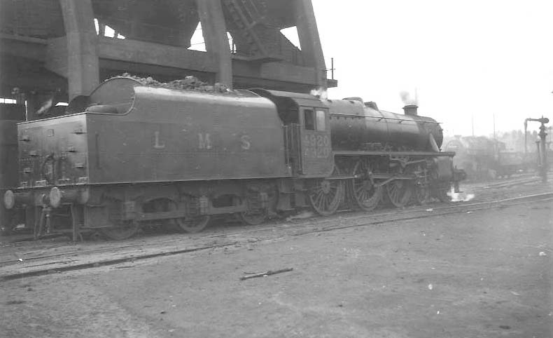 LMS 5MT 4-6-0 No 4920 is seen passing alongside Saltley's coaling tower on its way out of the yard having just been coaled