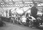 Ex-LMS 8F 2-8-0 No 48271 is seen standing inside one of Saltley Shed's roundhouses with steam escaping from its cylinder cocks on 2nd April 1950