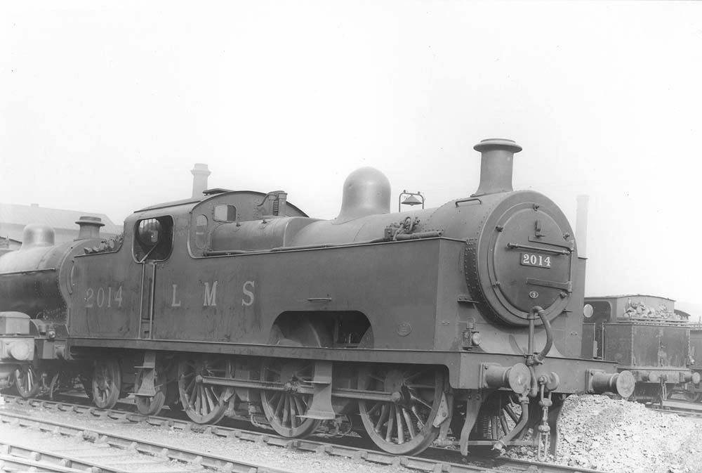 Ex-MR 3P 0-6-4T 'Flatiron' No 2014 stands outside No 3 roundhouse on a stabling road that clearly has become an unofficial disposal road