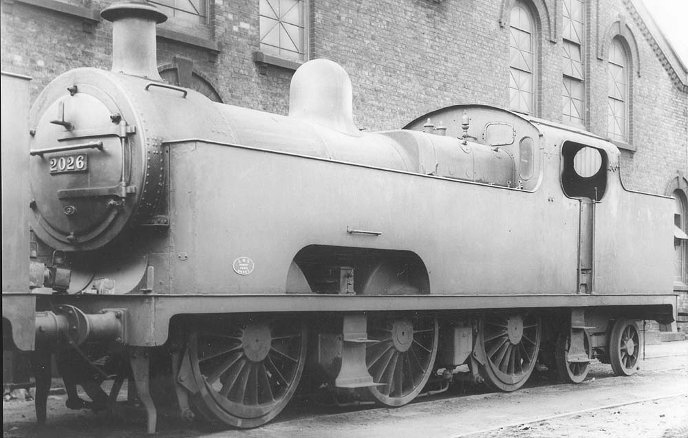 Ex-MR 3P 0-6-4T 'Flatiron' No 2026 is seen standing alongside Saltley's No 3 roundhouse with its lamp position in the centre on the bufferbeam