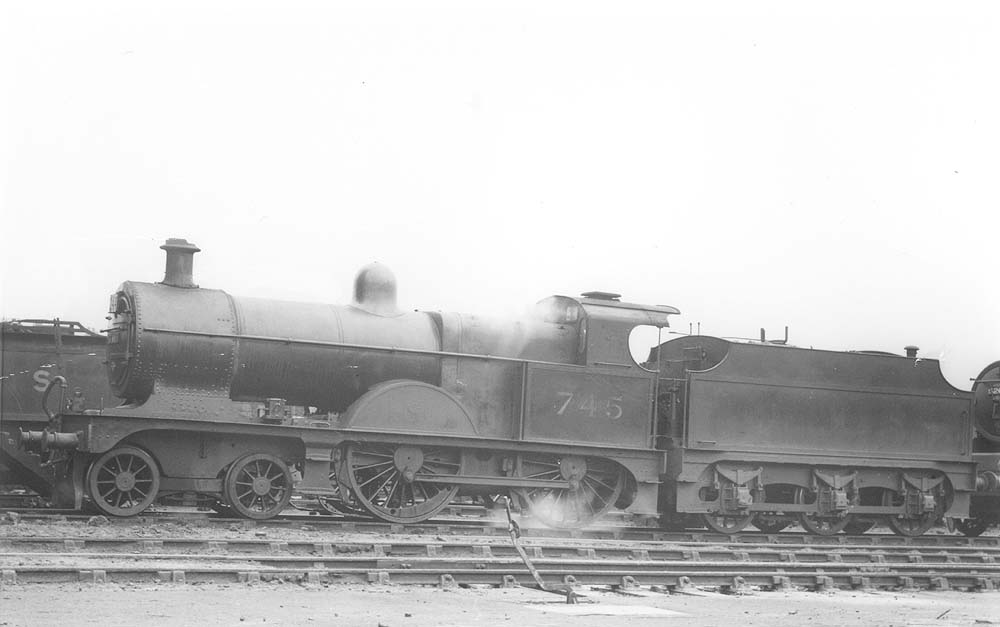 Ex-MR 3P 4-4-0 No 745, a member of the MR's 2606 class, stands in steam on one of Saltley's stabling roads in front of No 3 roundhouse