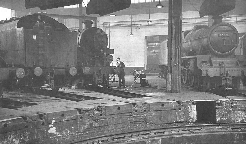 BR Standard 5MT 4-6-0 No 73069 is being repaired by one of Saltley's fitters on 22nd November 1964