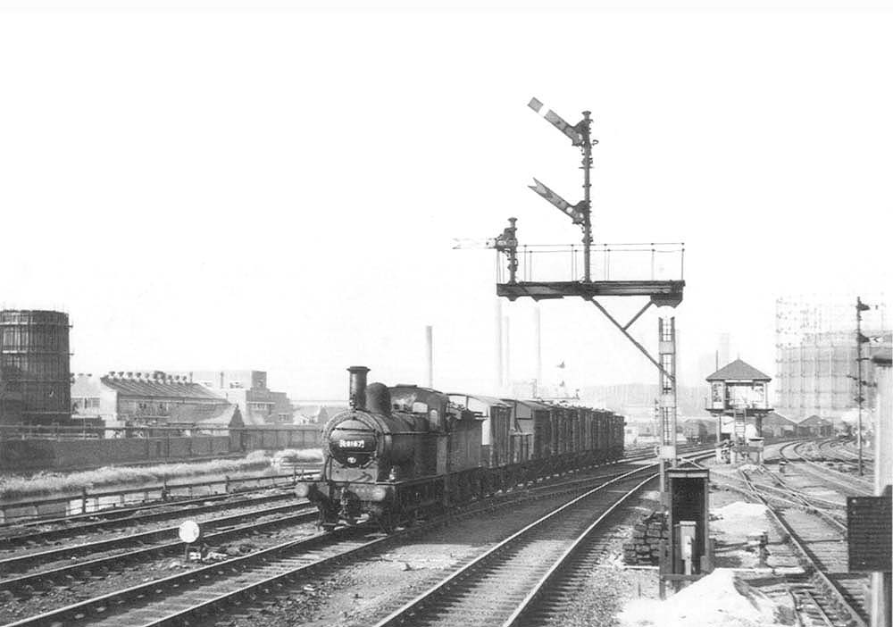 Saltley Station: Ex-MR 2F 0-6-0 No 58167 heads a freight working on the ...