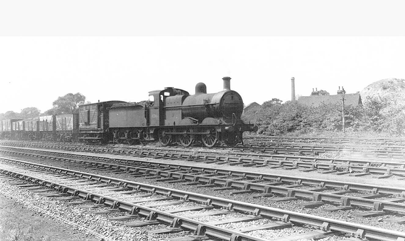 An unidentified ex-MR 0-6-0 locomotive heads a coal train on the steeply graded Stockingford branch