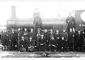 MR 0-6-0 No 646, a member of the 700 Class wearing its pre-1907 number, forms the background to a group photograph