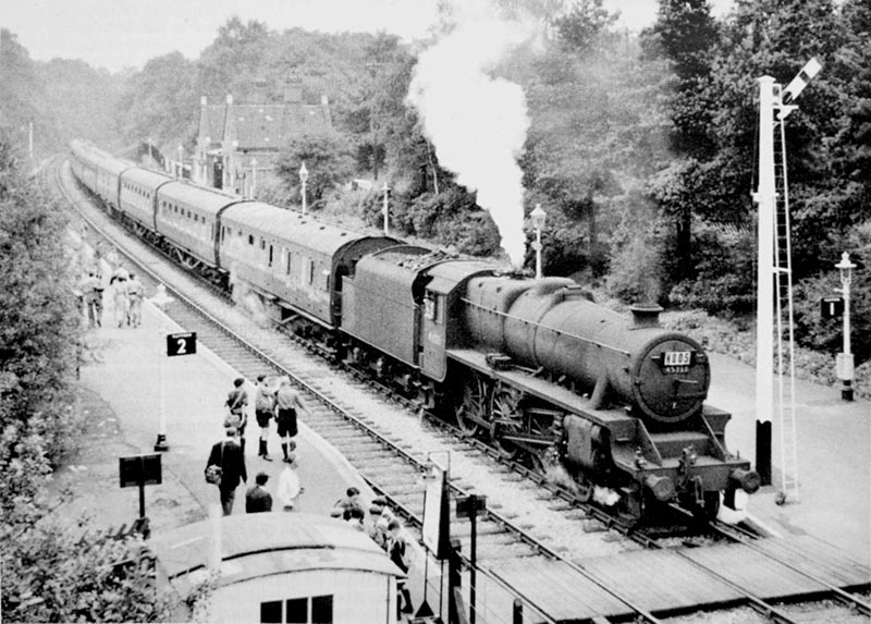 Ex-LMS 5MT 4-6-0 No 45333 passes through the station with empty coaching stock during August 1957