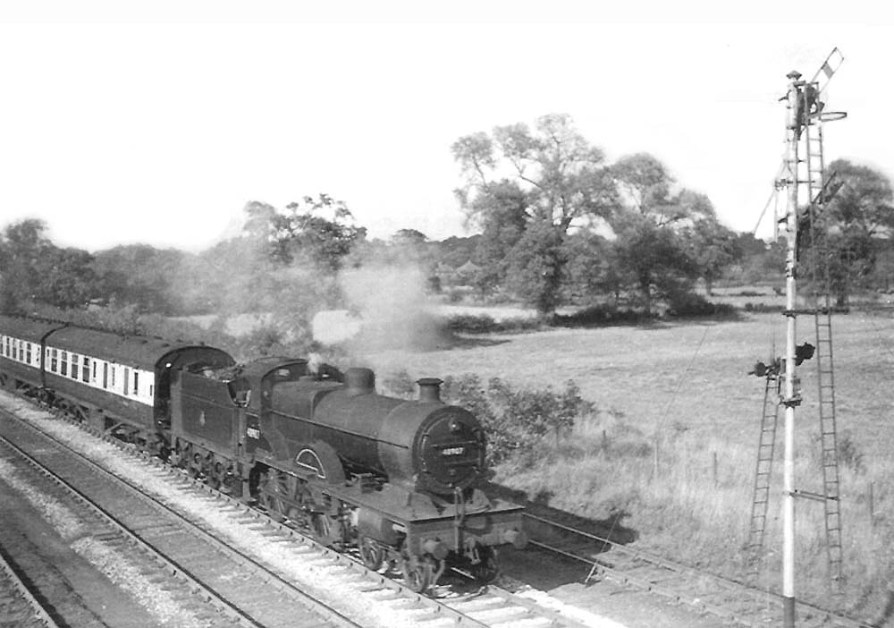Ex-LMS 4P 4-4-0 No 40907 approaches Whitacre with an Ordinary passenger service on 1st September 1952