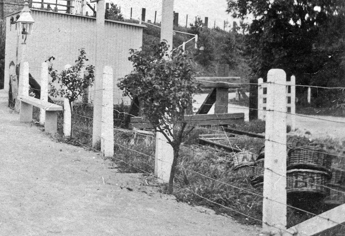 Close up showing the buffer stop to what appears to be a the siding made up of old railway sleepers