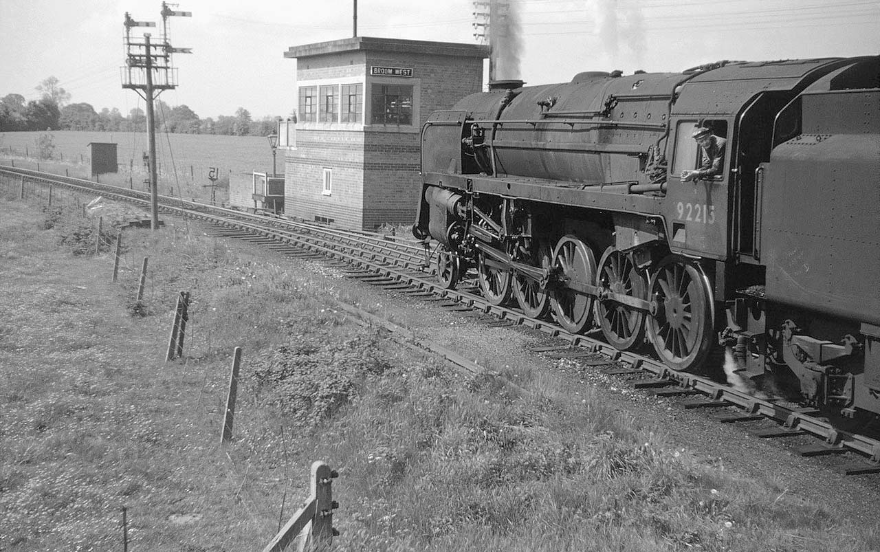 British Railways Standard Class 9F 2-10-0 No 92213 approaches Broom West Signal Box with a westbound freight service