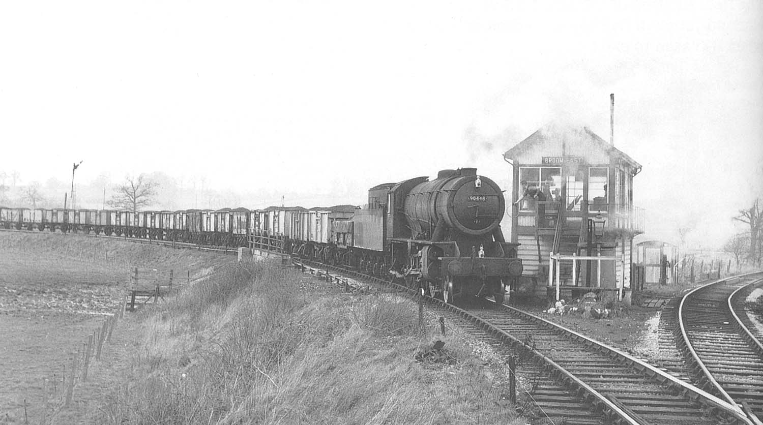 Ex-WD 'Austerity' 2-8-0 No 90448, on a Class H service, collects the staff from Broom East Signal Box