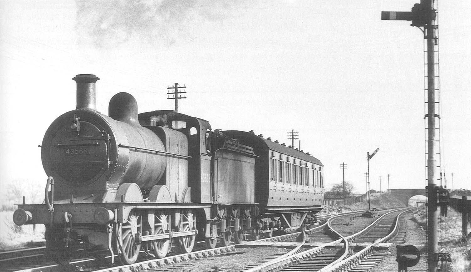Ex-MR 3F 0-6-0 No 43568 passes Clifton Signal Box with a down passenger service on 15th March 1952