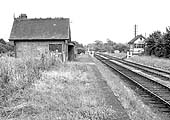 Looking towards Kineton with the station now abandoned and the platforms overgrown and cutback or removed