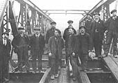 Workmen pose for the camera on the newly completed Goldicote Cutting farm bridge in February 1916